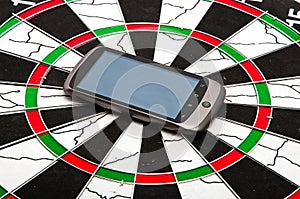 Smart phone on dartboard