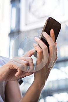 Smart phone in female hand.