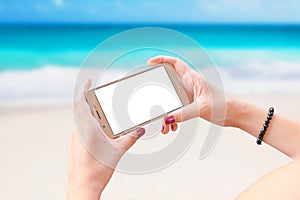 Smart phone mockup in horizontal position. Concept of cell phone use on summer holiday, beach