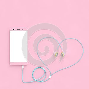 Smart phone pastel pink color and earphones wire heart shape