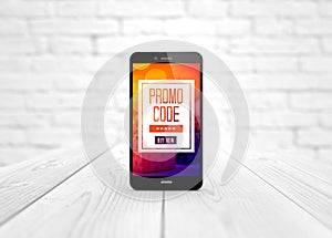 smart phone promo code over wooden table photo