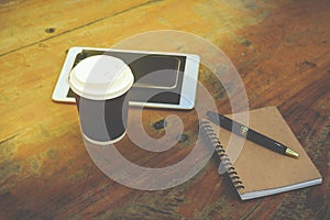 Smart phone, tablet, note book, pen and coffee