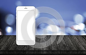 Smart phone on wooden desk. White phone with isolated, white, blank screen for mockup