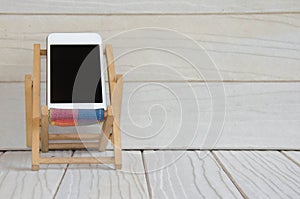 Smart phone on wooden table background with copy space