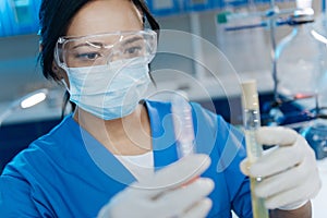 Smart pleasant woman working in the medical lab