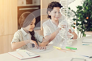 Smart positive children studying biology