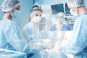Smart professional team of surgeons working