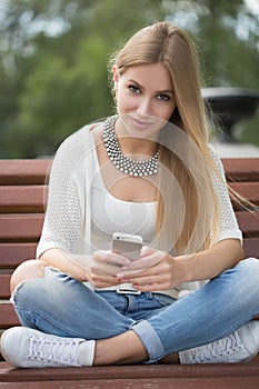 Smart professional woman reading using phone