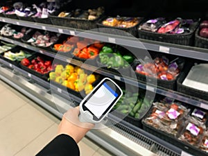 Smart remote control grocery shopping the self check-out are on display at a supermarket