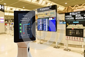 Smart robotic technology concept, The passenger follow a service robot to a counter check in in airport, the robot can help and gi photo