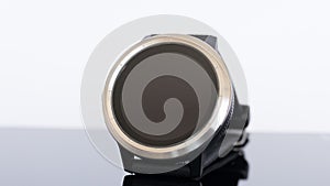 Smart round watch isolated on a mirror board