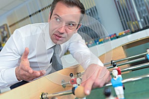 smart salesman demonstrating table football game