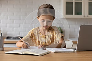 Smart schoolgirl study online on computer from home