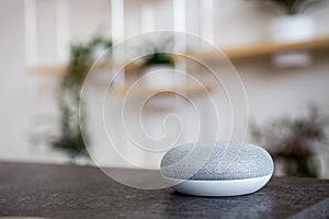 Smart speaker on table desk, voice controlled, device, smart home assistant device