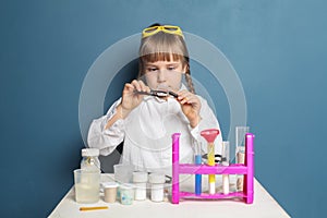 Smart student child girl with science experiment