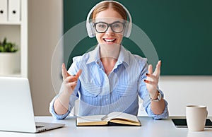 Smart teacher talking to camera