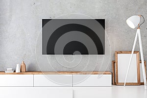 Smart Tv Mockup with blank screen hanging on the concrete wall in modern interior