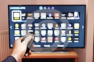 Smart tv UHD 4K controled by remote control. photo