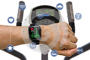 Smart Watch Monitoring Heart Rate Application Concept While Exercising with Elliptical Machine