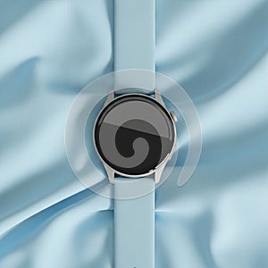 Smart watch with a silver frame and a black screen is displayed on a