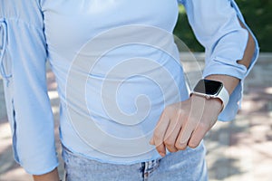 Smart watch on the woman`s hand. Outdoors
