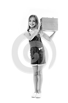 Smart ways to save on clothing. Girl cute teenager carries shopping bag. Kid bought clothing sale. Loyalty program helps