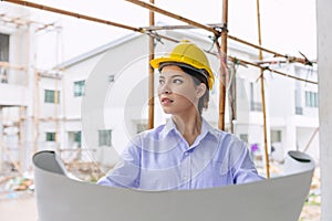 Smart woman engineer worker builder worker in construction site. Architect home project chief designer officer with building floor