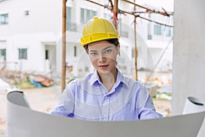 Smart woman engineer worker builder worker in construction site. Architect home project chief designer officer with building floor