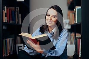 Smart Woman Looking at Bookshelves in a Library