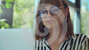 Smart woman working in cafe with gadgets. Lifestyle, 20-25 years old