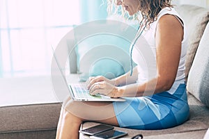 Smart work and job technology related concept for young business woman manager type on a modern laptop computer sitting on the