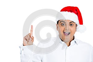 Smart xmas man with index finger pointing up