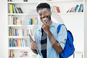 Smart young african american male student with beard