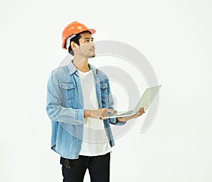 Smart young asian architect engineer man wear casual jean and orange safety helmet which hand holding laptop to check his plan