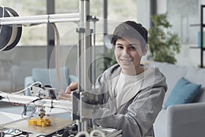 Smart boy using a 3D printer at home