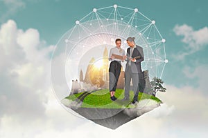 Smart young businessman and businesswoman discuss,standing on green island with cityscape floating in air,sky background,abstract