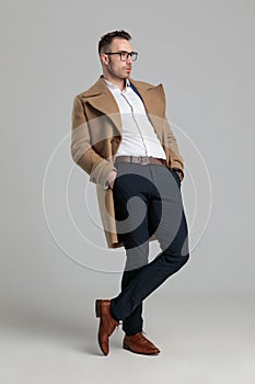 Smartcasual man wearing glasses and long coat