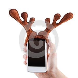 Smartphon christmas funny concept, reindeer antlers toy, Isolated on white