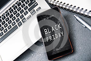 Smartphone with black friday banner on the screen