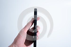 Smartphone in Black Leather Case in Hand