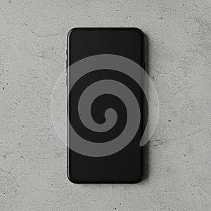 A smartphone with a black screen is placed on a light gray concrete surface. The