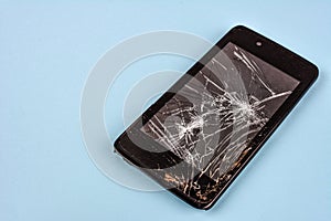 Smartphone with broken screen .Broken mobile phone lying on pavement