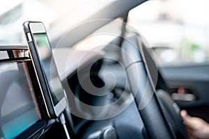 Smartphone on car console. GPS navigation app