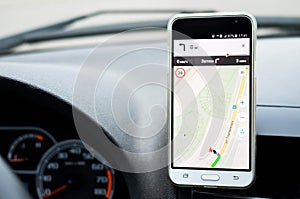 Smartphone in a car use for navigate or GPS.