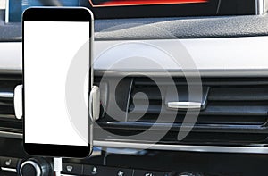 Smartphone in a car use for Navigate or GPS. Driving a car with Smartphone in holder. Mobile phone with isolated white screen.