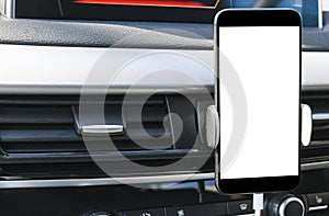 Smartphone in a car use for Navigate or GPS. Driving a car with Smartphone in holder. Mobile phone with isolated white screen.