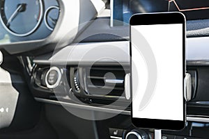 Smartphone in a car use for Navigate or GPS. Driving a car with Smartphone in holder. Mobile phone with isolated white screen.