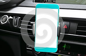 Smartphone in a car use for Navigate or GPS. Driving a car with Smartphone in holder. Mobile phone with isolated white screen. Bla