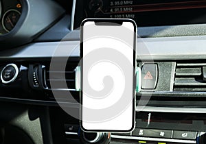 Smartphone in a car use for Navigate or GPS. Driving a car with Smartphone in holder. Mobile phone with white screen. Bla