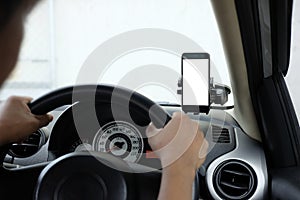 Smartphone in a car use for Navigate or GPS. Smartphone in holder. Mobile phone with isolated white screen.